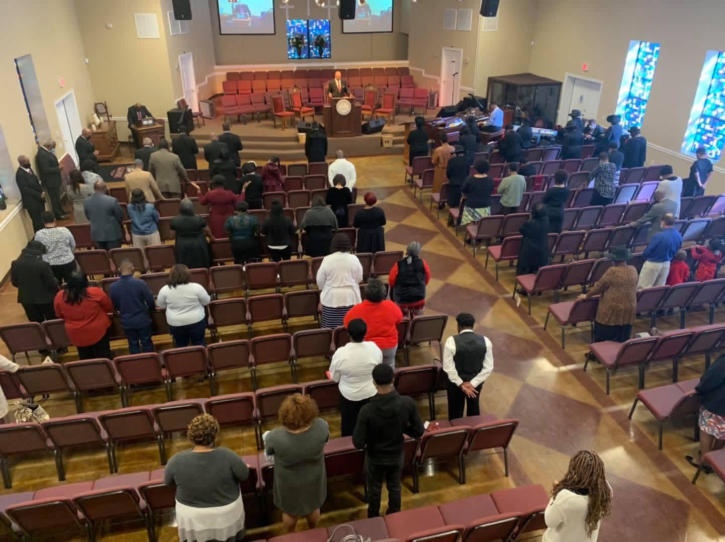 Members of Greater Grove Street standing together in worship
